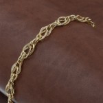 Turkish Bracelet in Gold Color Made of 925 Sterling Silver with Curved Interlocking Rings Design