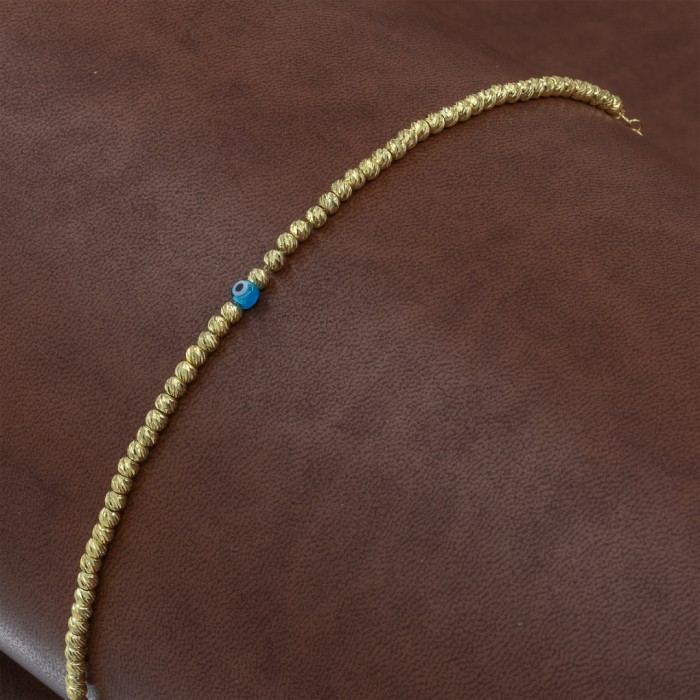 Sterling Silver Bracelet with Yellow Gold Beads and Blue Evil Eye Bead